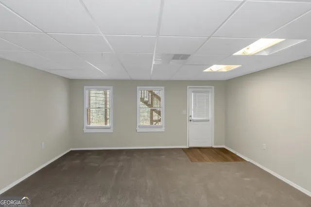 an empty room with a empty space and window