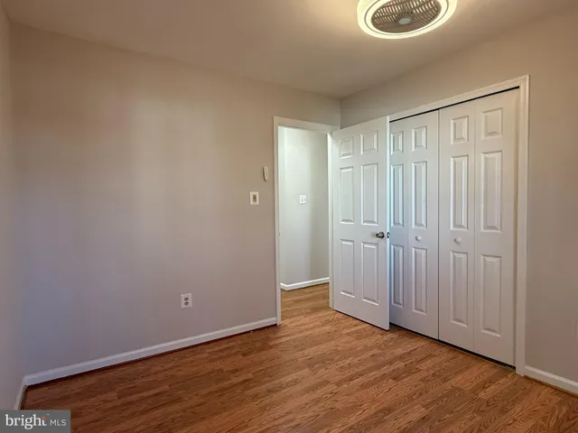 a view of a storage & utility room with wooden floor