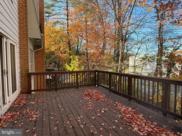 a view of wooden balcony with wooden floor