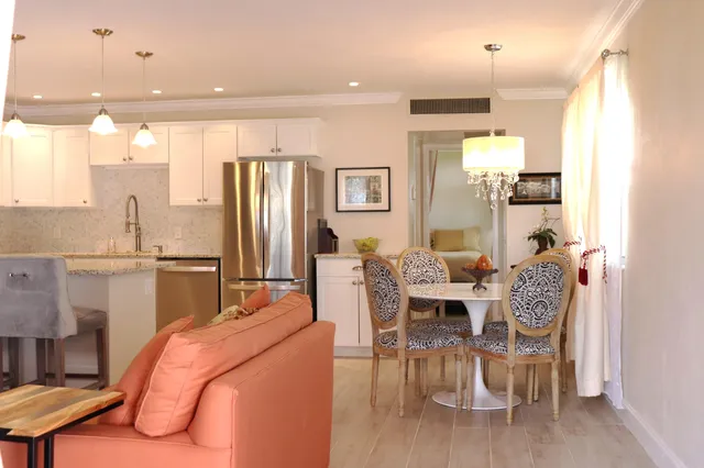 a dining room with a table and chairs