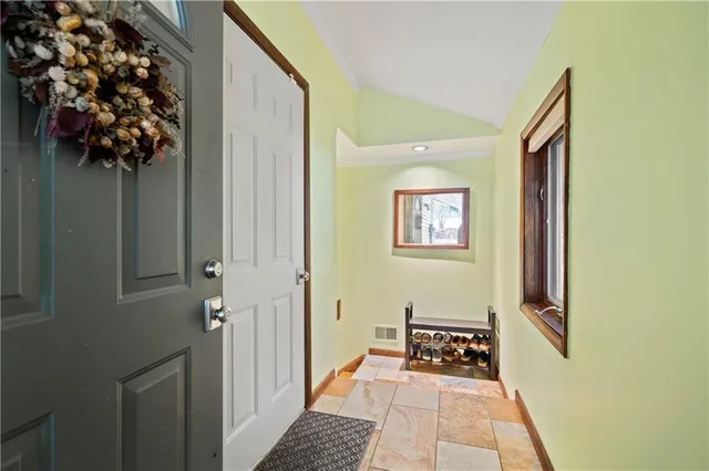 a view of a door and wooden floor