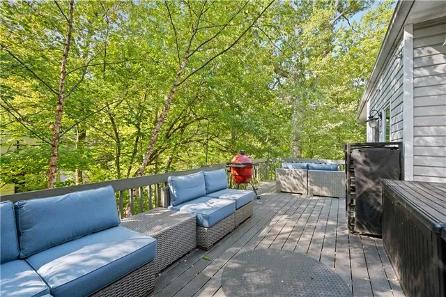 a outdoor living space with furniture and a fireplace