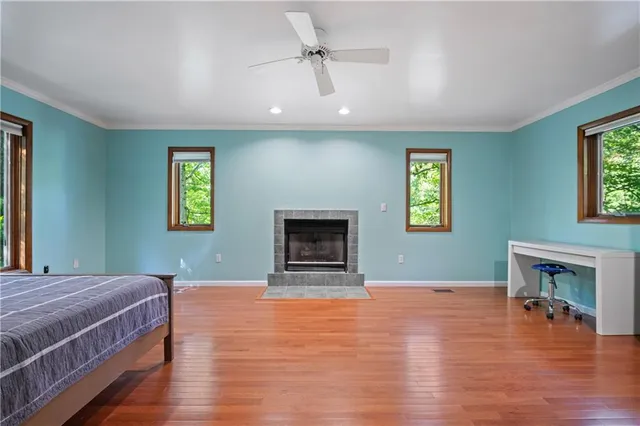 a bedroom with a bed and a fireplace