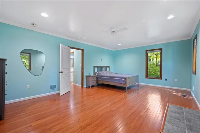 a view of a room with wooden floor window and staircase