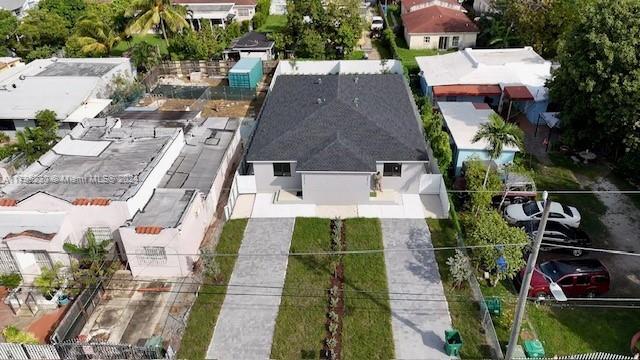 2011 Northwest 26th Street, Unit 2011 Miami, FL 33142 - Photo 3 of 7 an aerial view of a house with outdoor space