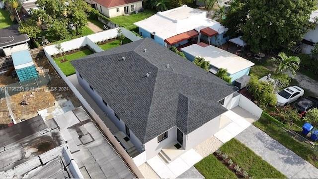 2011 Northwest 26th Street, Unit 2011 Miami, FL 33142 - Photo 4 of 7 an aerial view of a house with a yard