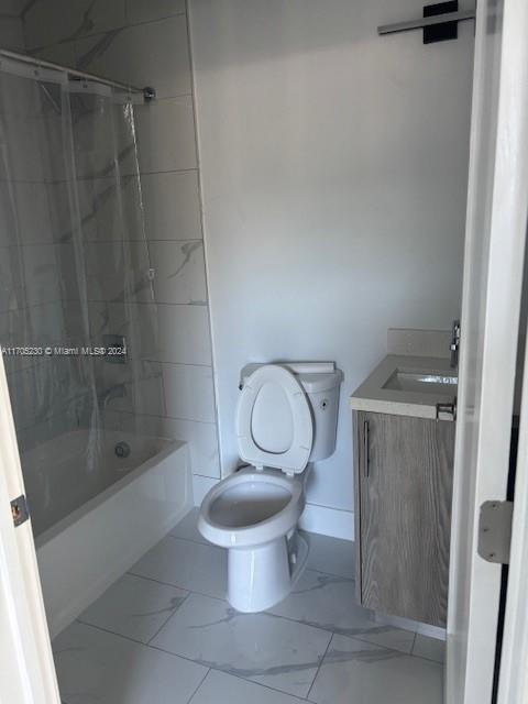 2011 Northwest 26th Street, Unit 2011 Miami, FL 33142 - Photo 5 of 7 a bathroom with a toilet and a shower
