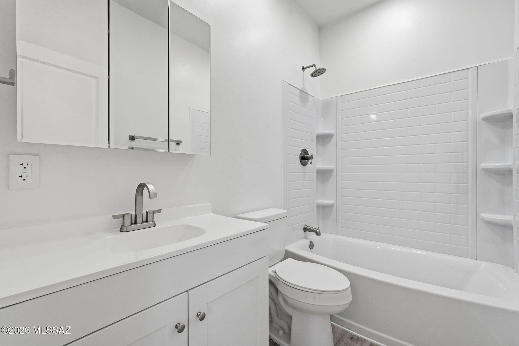 950 West Ina Road Tucson, AZ 85704 - Photo 44 of 54 a bathroom with a sink a toilet and a bathtub