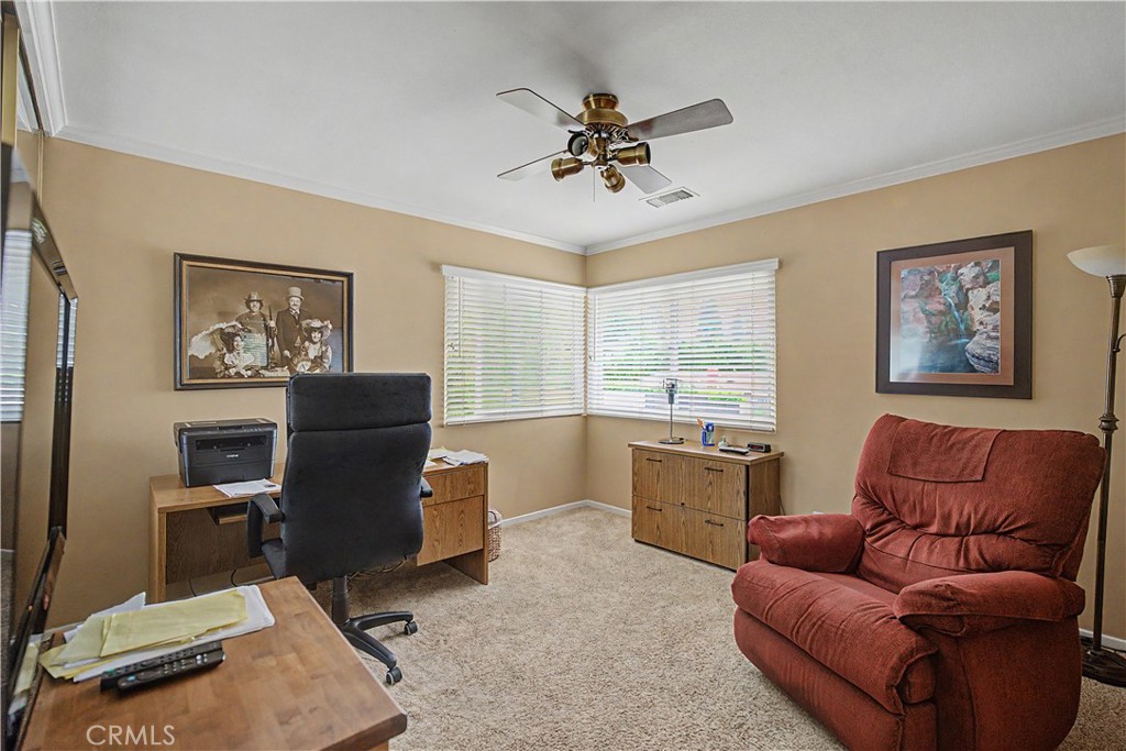 22671 Town Crier Road Calabasas, CA 91302 - Photo 32 of 35 a living room with furniture and a large window