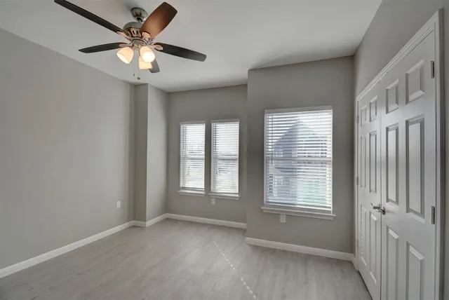 a bathroom with a sink a light fixture and a mirror
