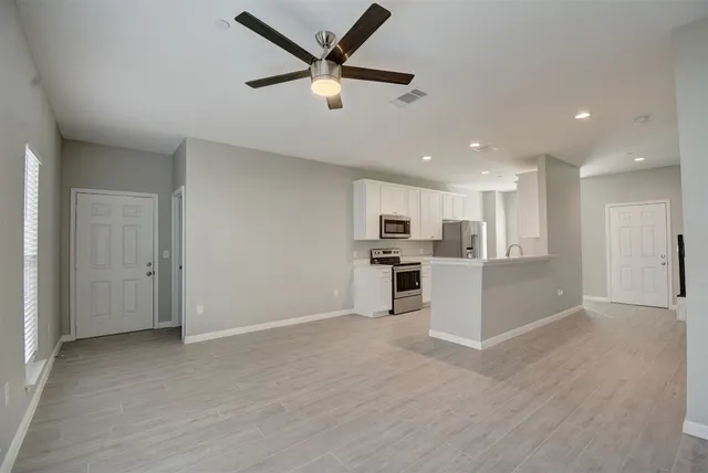 a street view with tall buildings and a street light