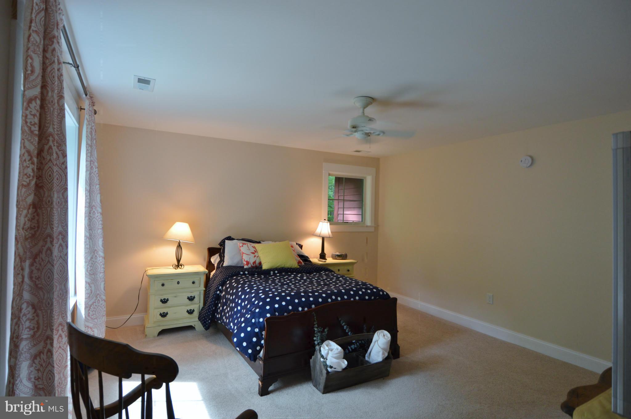 14000 Longnecker Road Reisterstown, MD 21136 - Photo 21 of 30 a bedroom with a bed and a lamp on dresser