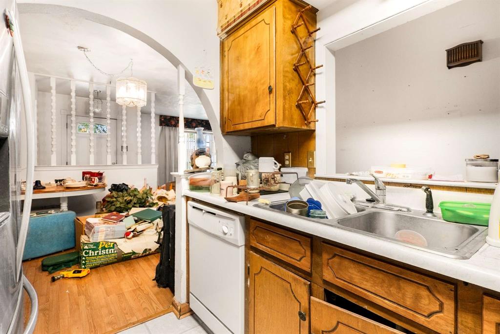 3024 Conflans Road, Unit 3026 Irving, TX 75061 - Photo 12 of 29 a kitchen with a sink and a stove next to a window