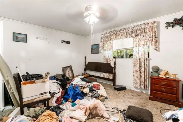 a bedroom with bed and a window
