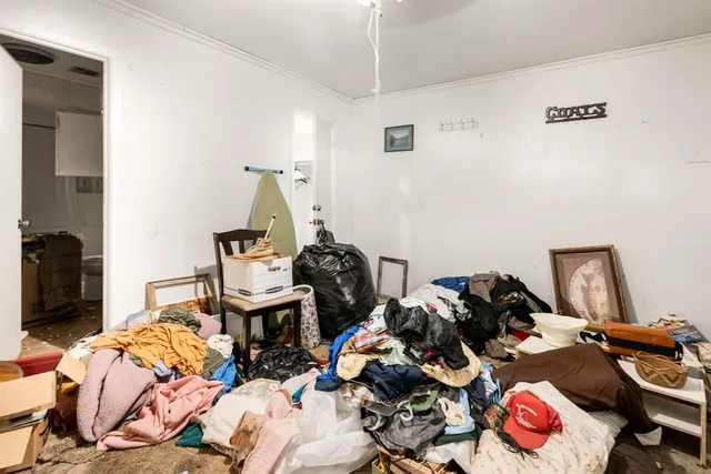 a bedroom with two beds and a couch