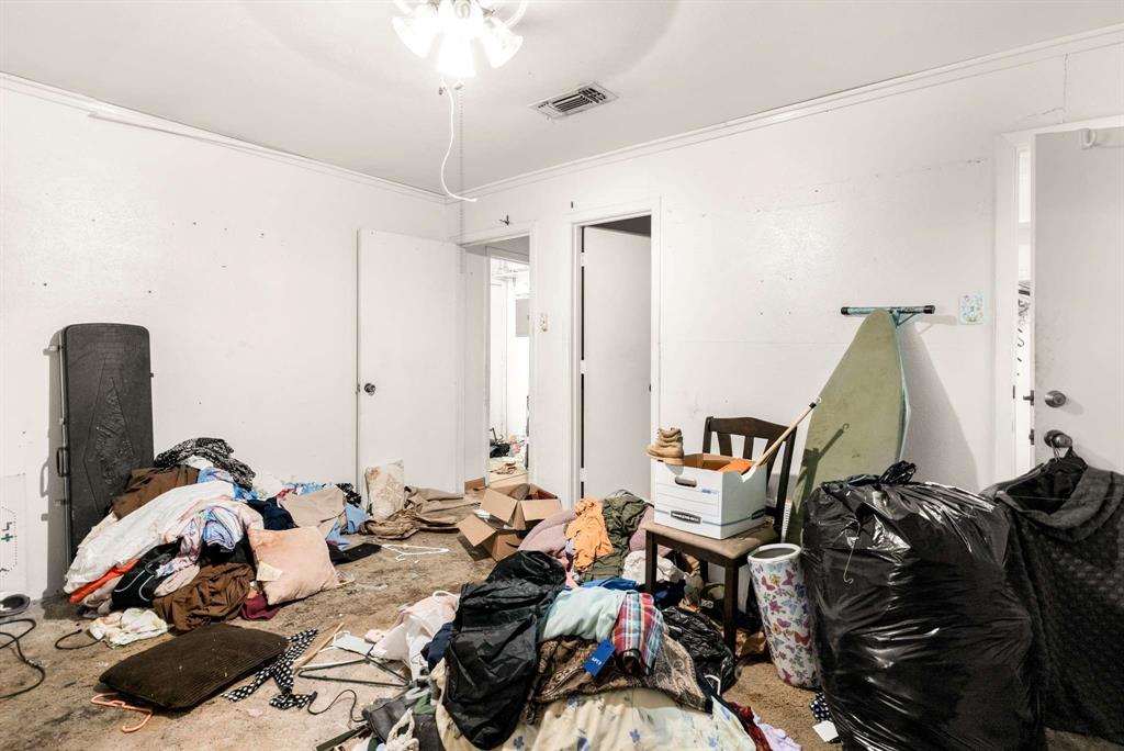 3024 Conflans Road, Unit 3026 Irving, TX 75061 - Photo 17 of 29 a bed room with furniture and a wooden floor