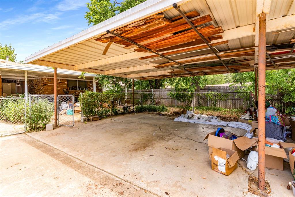 3024 Conflans Road, Unit 3026 Irving, TX 75061 - Photo 23 of 29 a view of a backyard with table and chairs potted plants