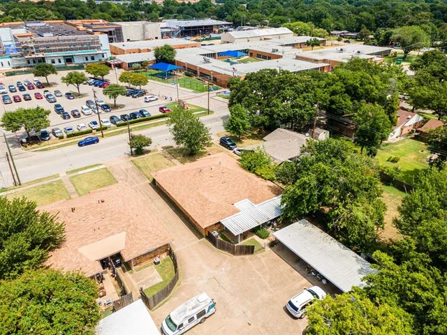 an aerial view of a house with swimming pool and outdoor space