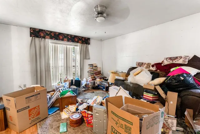 a bedroom with furniture and a window