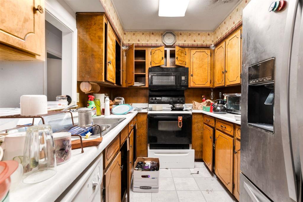3024 Conflans Road, Unit 3026 Irving, TX 75061 - Photo 10 of 29 a kitchen with stainless steel appliances a sink cabinets and a window