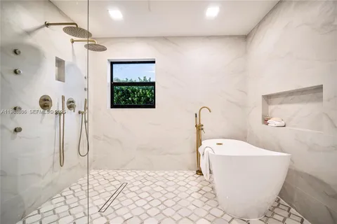 a bathroom with a glass door shower