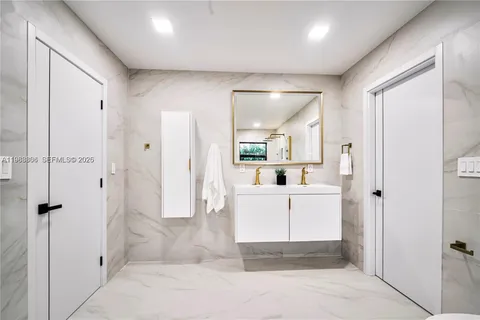 a white bath tub sitting in a bathroom