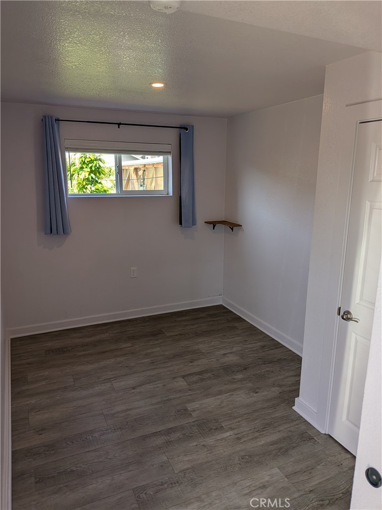 4020 F Street Eureka, CA 95503 - Photo 12 of 15 an empty room with wooden floor and windows