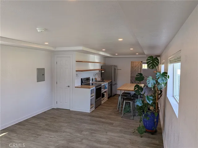 a view of kitchen with furniture and a potted plant
