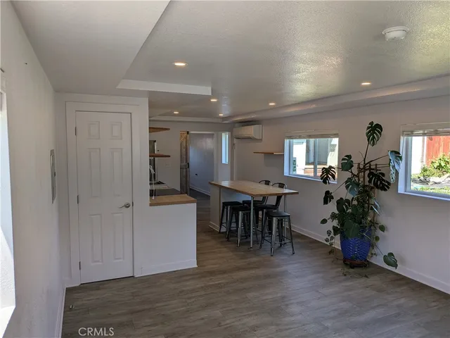 a view of dining room with furniture and wooden floor