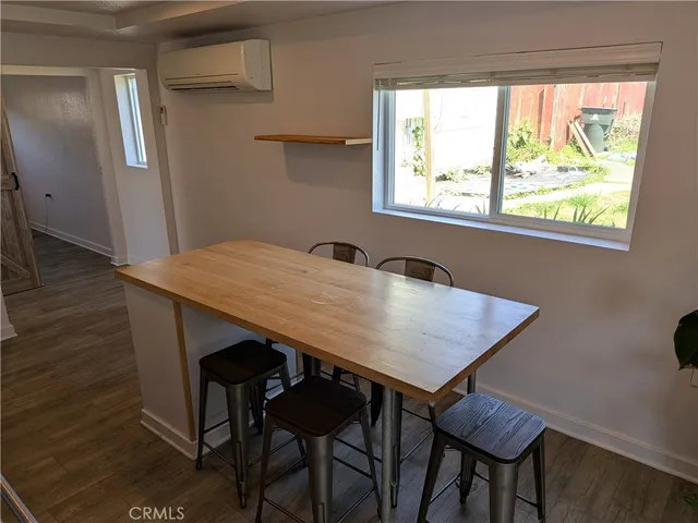 a view of a dining table and chairs in a room
