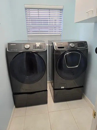 a utility room with dryer and washer
