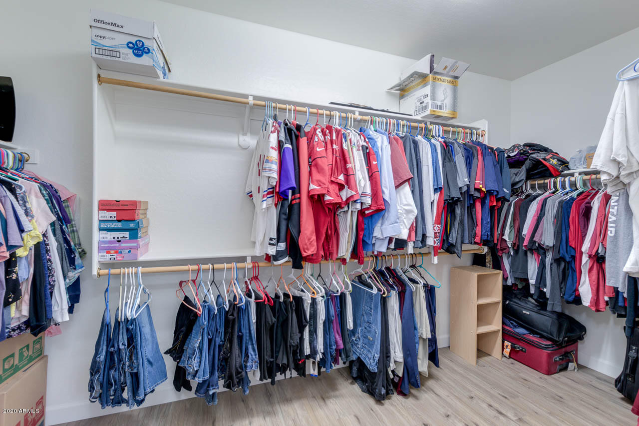 3315 East Los Altos Road Gilbert, AZ 85297 - Photo 37 of 66 a view of walk in closet with clothes