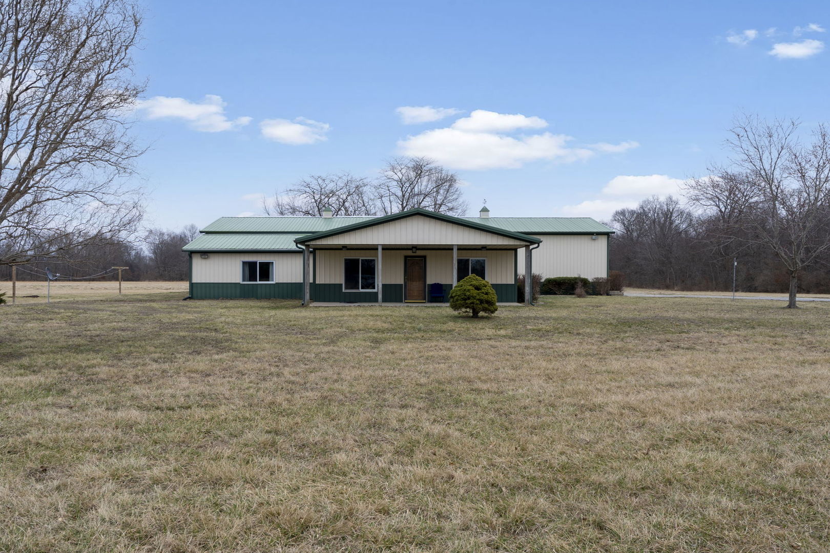 7198 Omega Road Kinmundy, IL 62854 - Photo 2 of 95 a front view of house with yard and trees
