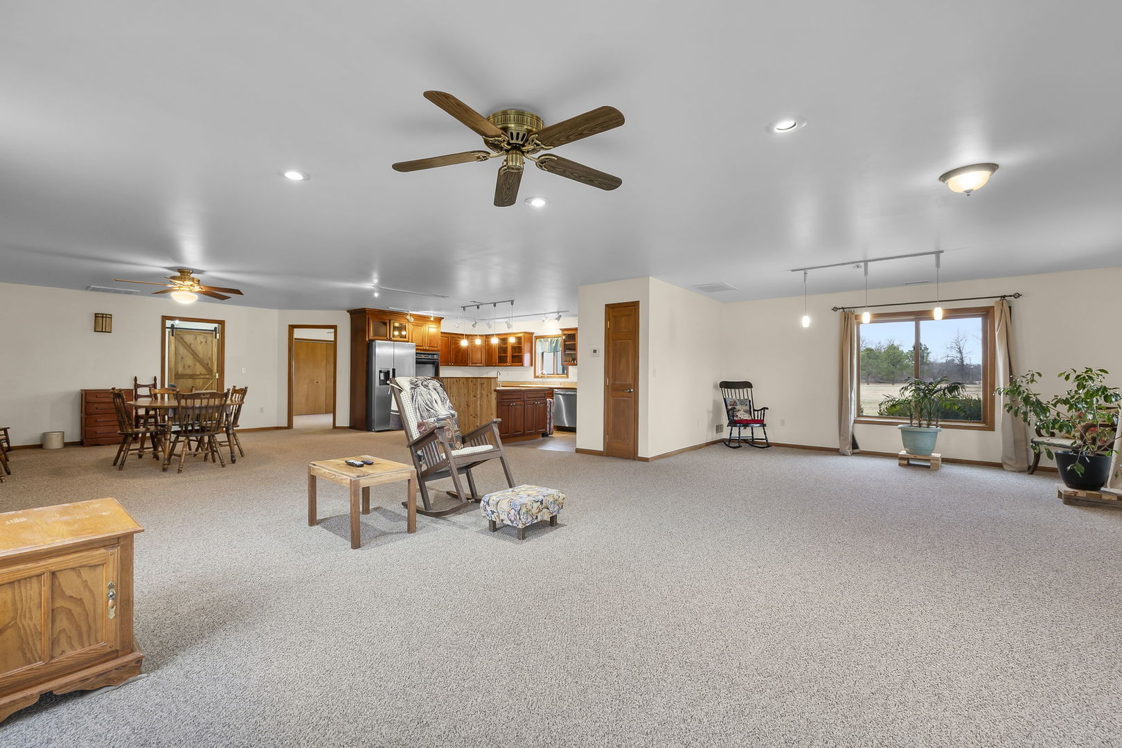 7198 Omega Road Kinmundy, IL 62854 - Photo 26 of 95 a view of a livingroom with furniture and a floor to ceiling window