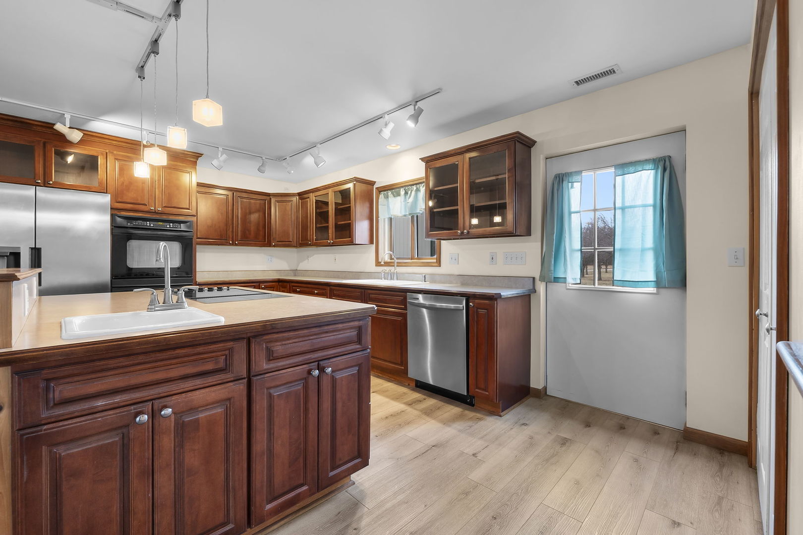 7198 Omega Road Kinmundy, IL 62854 - Photo 30 of 95 a kitchen with a sink and wooden cabinets