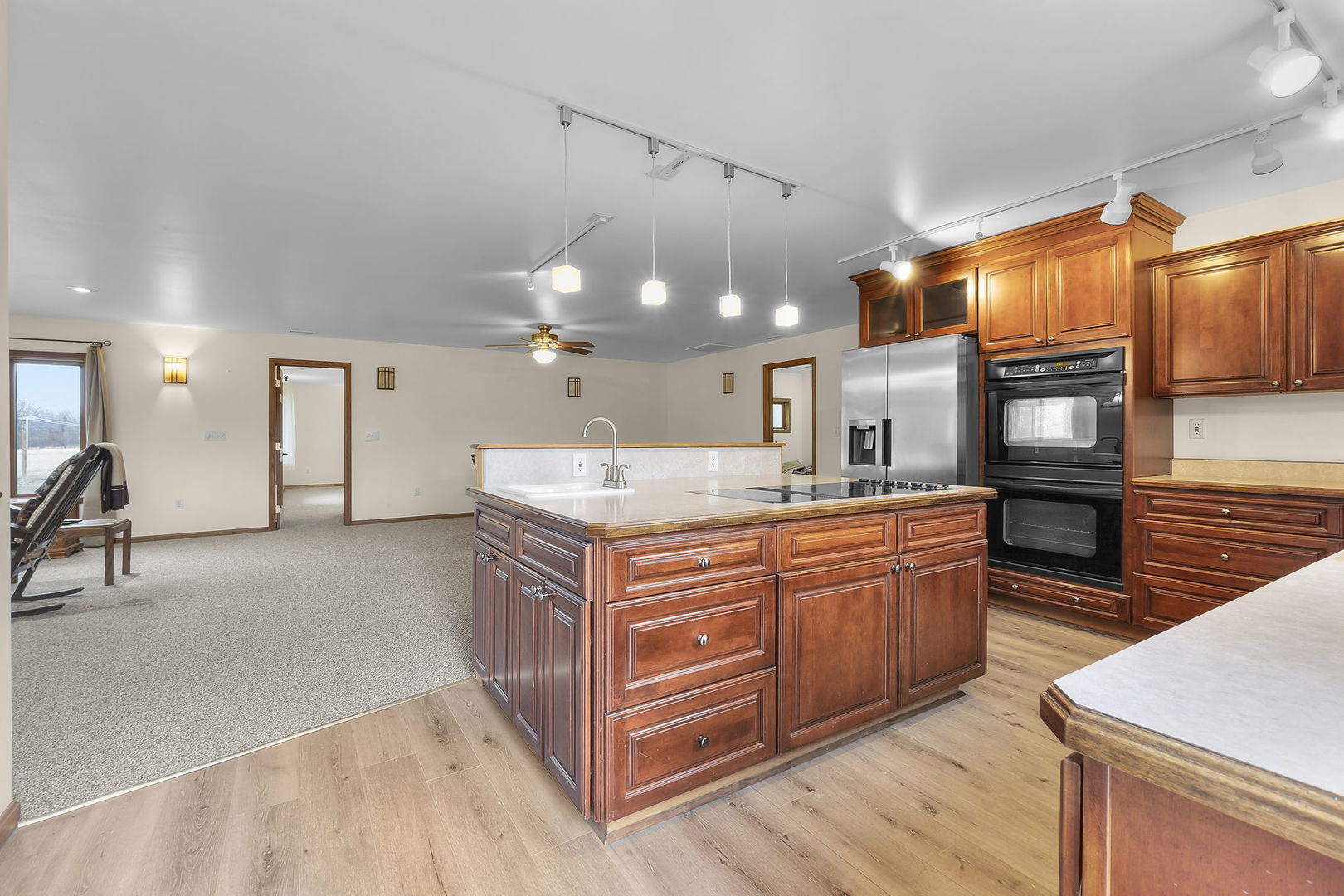 7198 Omega Road Kinmundy, IL 62854 - Photo 33 of 95 a kitchen with stainless steel appliances kitchen island granite countertop a stove a sink and a refrigerator