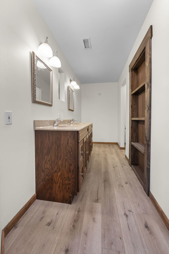 7198 Omega Road Kinmundy, IL 62854 - Photo 38 of 95 a view of a kitchen cabinets a sink and wooden floor