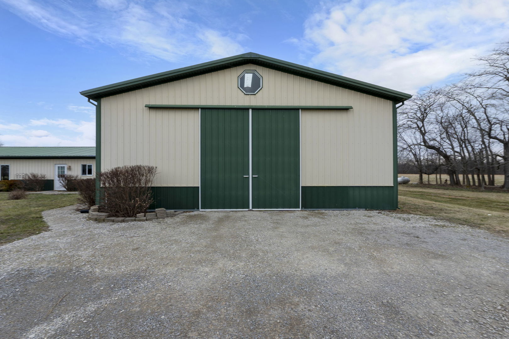 7198 Omega Road Kinmundy, IL 62854 - Photo 7 of 95 a front view of a house with a yard and garage
