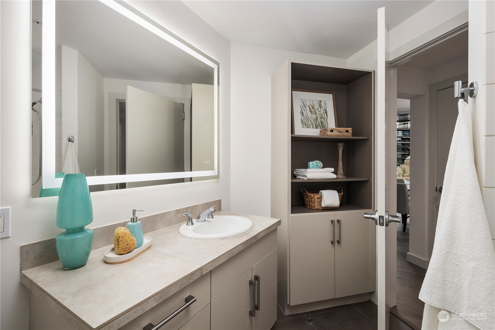 910 Lenora Street, Unit S1003 Seattle, WA 98121 - Photo 13 of 28 a bathroom with a sink and a mirror