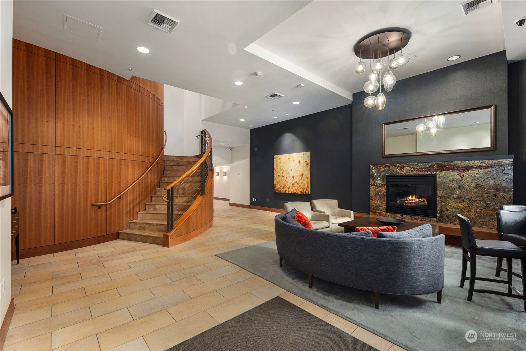 910 Lenora Street, Unit S1003 Seattle, WA 98121 - Photo 20 of 28 a living room with fireplace furniture and a flat screen tv
