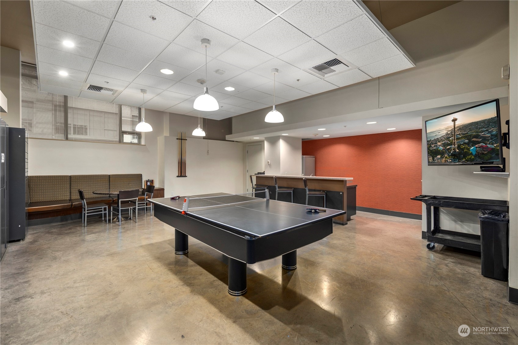 910 Lenora Street, Unit S1003 Seattle, WA 98121 - Photo 22 of 28 a kitchen with a table and chairs in it