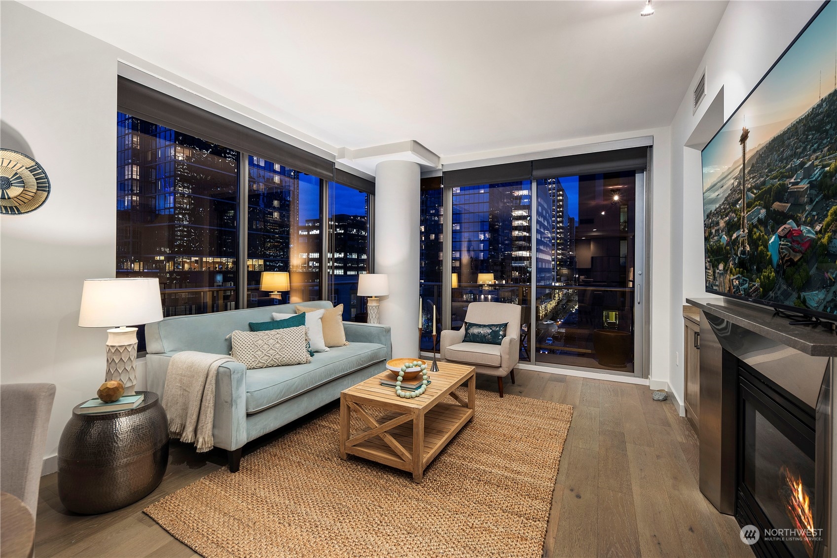 910 Lenora Street, Unit S1003 Seattle, WA 98121 - Photo 6 of 28 a living room with furniture and a fireplace