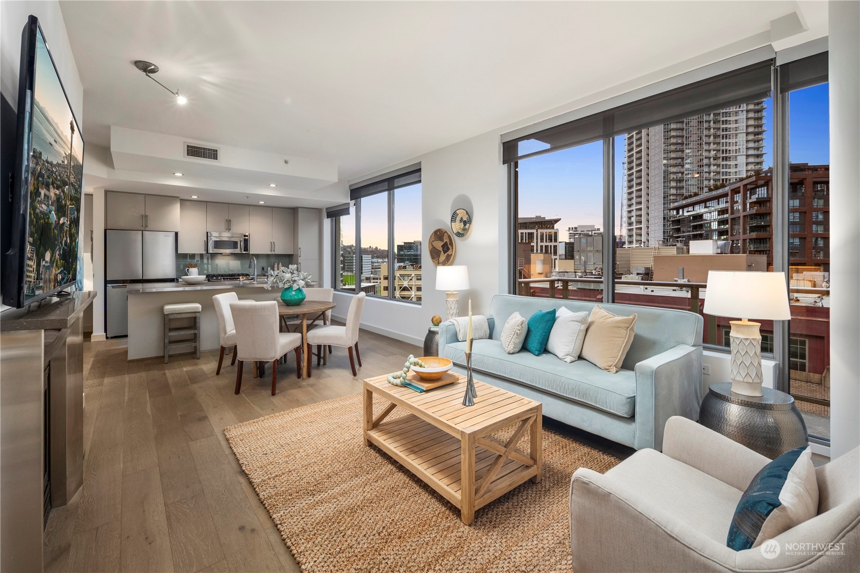 910 Lenora Street, Unit S1003 Seattle, WA 98121 - Photo 7 of 28 a living room with furniture and a large window