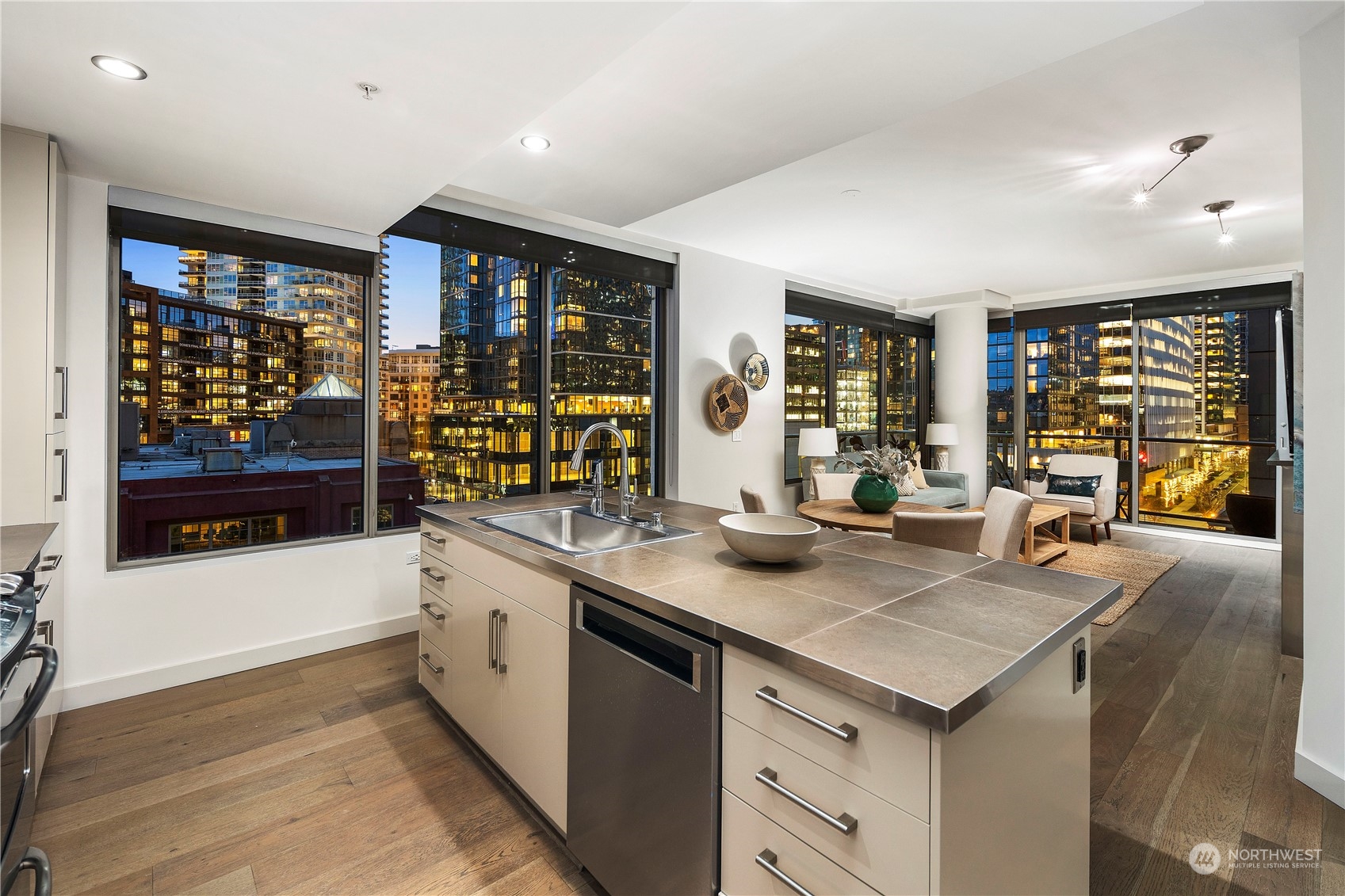 910 Lenora Street, Unit S1003 Seattle, WA 98121 - Photo 10 of 28 a kitchen with a sink stove and cabinets