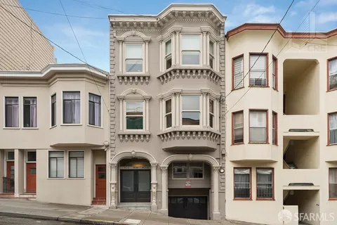 a front view of a building with a lot of windows