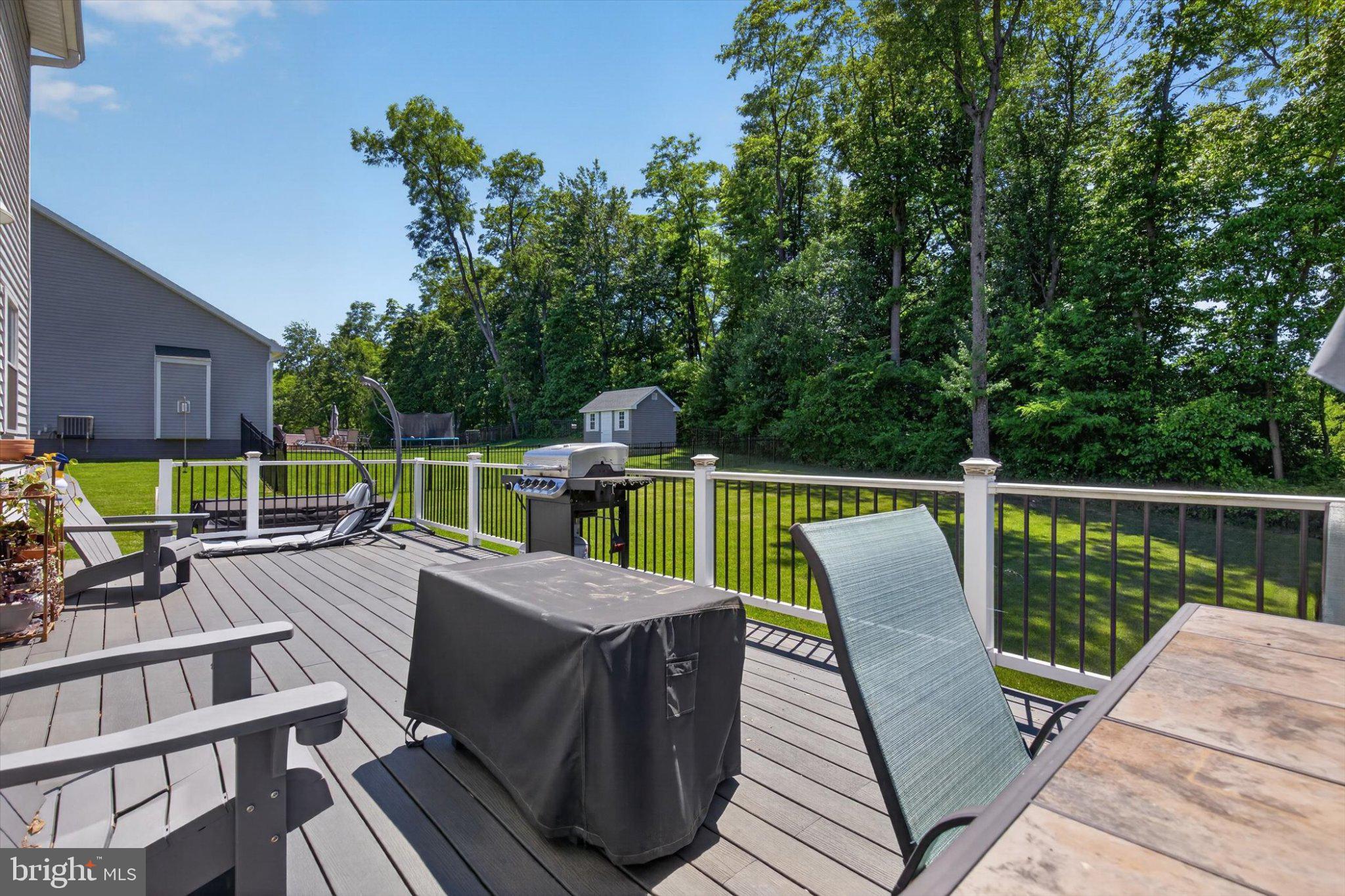 255 Kinneman Road Abbottstown, PA 17301 - Photo 17 of 39 Serene deck with lush green backdrop.