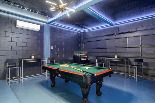 a room with furniture and pool table