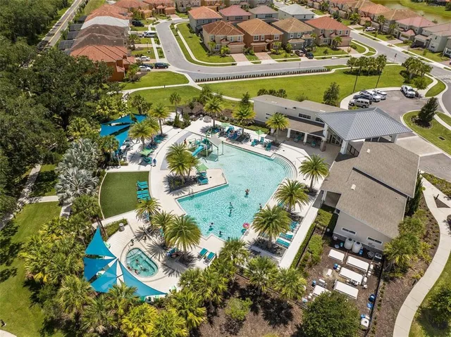 an aerial view of residential houses with outdoor space