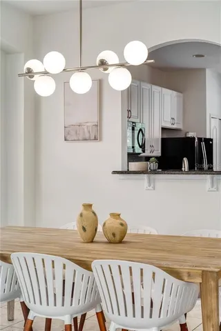 a kitchen with a table and chairs