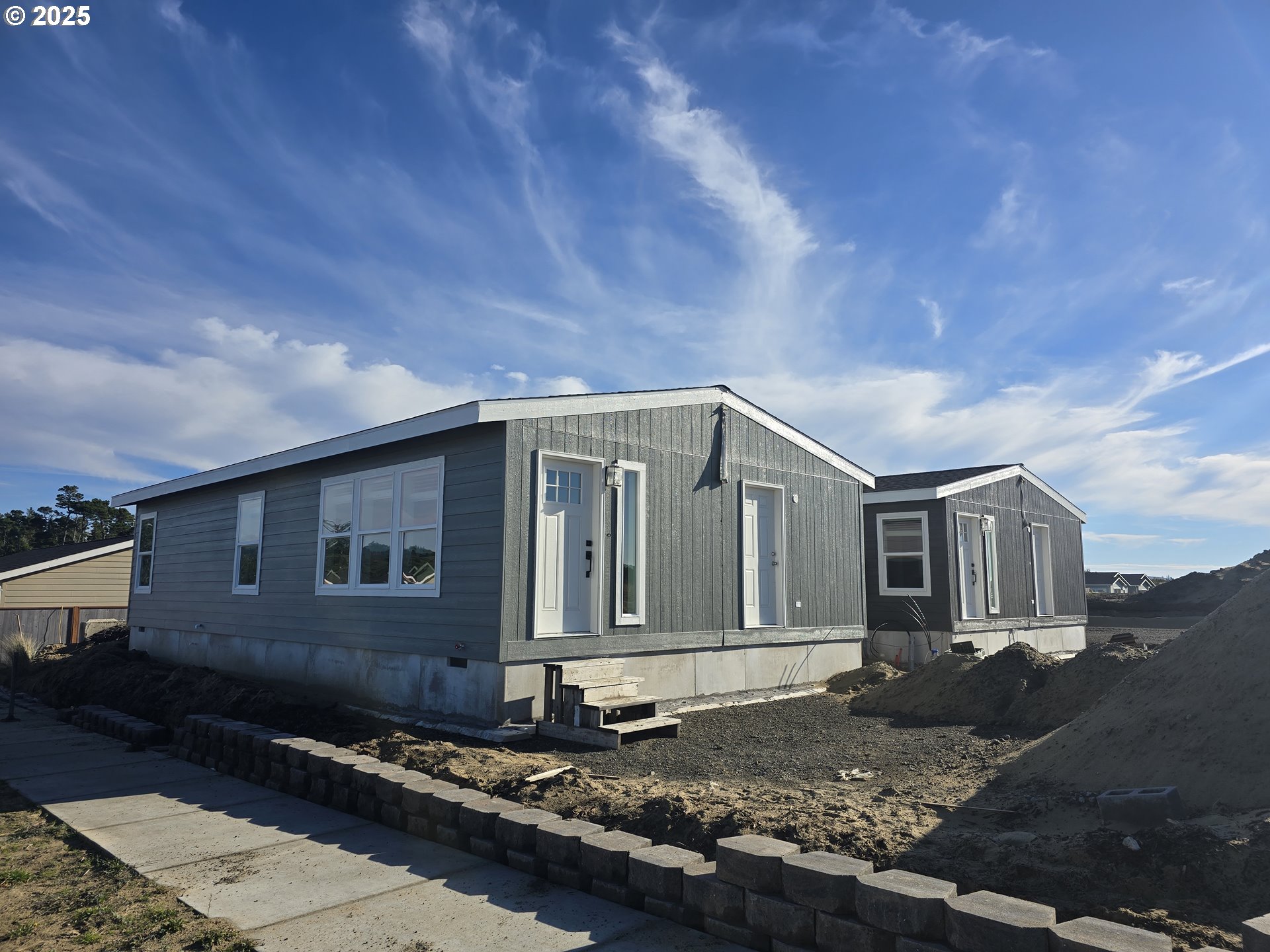 5299 Maple Street Florence, OR 97439 - Photo 3 of 5 a house view with a outdoor space